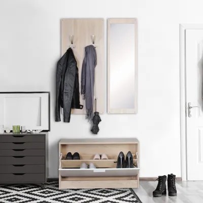 A hallway scene with a coat rack, mirror, shoe cabinet, and chest of drawers.