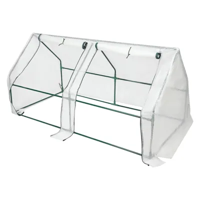 A white and green mini greenhouse.