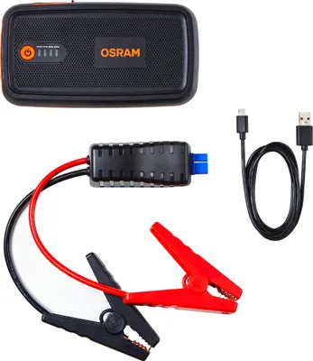 A car battery jump starter kit with its accessories laid out on a white background.