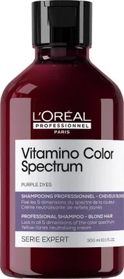 A bottle of L'Oréal Professionnel shampoo against a white background.