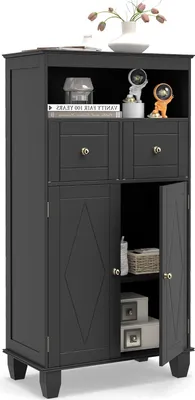 A black bathroom cabinet with two doors and two drawers, displaying decorative items on the top shelf.
