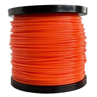 A spool of orange trimmer line on a white background.