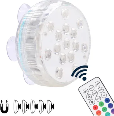 A submersible LED light with a remote control and suction cups.