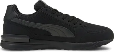 A black Puma sneaker shown from the side against a white background.