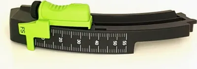 A black and green depth stop for a power tool is shown against a white background.