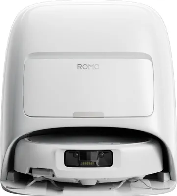 A white robot vacuum cleaner is shown from the front, docked in its charging station.