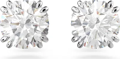 A pair of diamond stud earrings on a white background.
