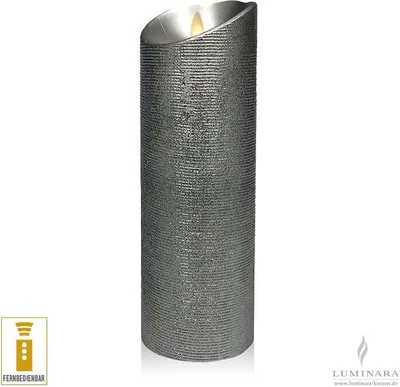 A silver LED candle with a textured surface and a flickering flame.