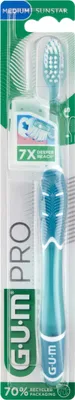 A product package for a GUM PRO toothbrush, showing the toothbrush handle and a replacement head.