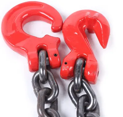 Two red lifting hooks with metal chains attached, isolated on a white background.