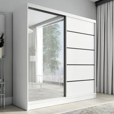 A white sliding door wardrobe with a mirrored door and black accents, shown in a modern room setting.