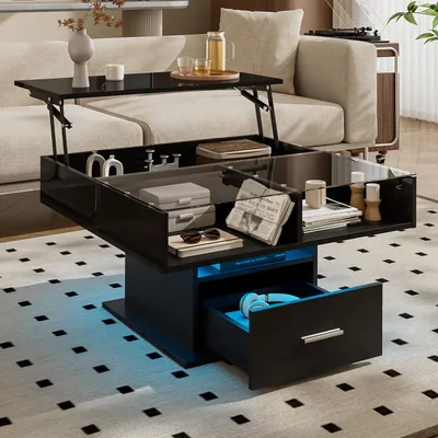 A modern living room with a black lift-top coffee table with LED lighting.
