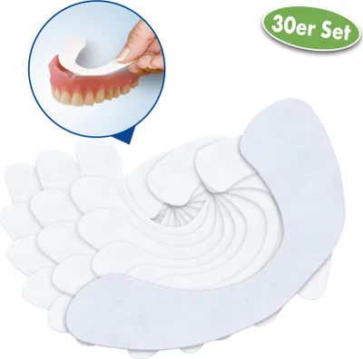 A close-up inset image shows a hand placing a denture liner onto a set of dentures. The main image displays a fanned-out pile of denture liners.