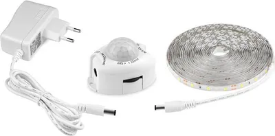 A white LED strip light kit, including a power adapter, a motion sensor, and a coiled LED strip, laid out on a white background.