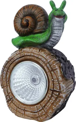 A solar-powered garden light shaped like a snail sitting on a log.