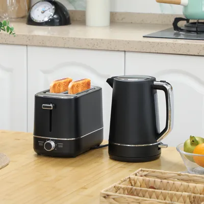 A black toaster with two slices of toast and a black electric kettle are displayed on a wooden countertop in a kitchen setting.