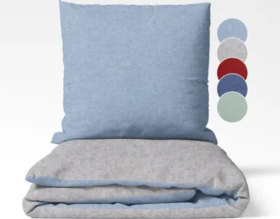 A folded duvet and pillowcase set, with a stack of colored circles to the right indicating color options.