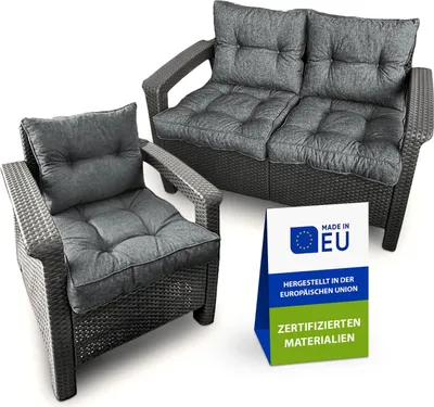 A set of outdoor lounge furniture cushions on a chair and a two-seater sofa, with a 'Made in EU' sign.