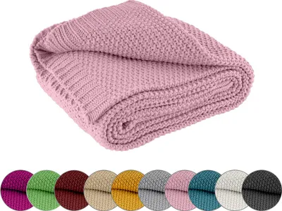 A folded pink knitted blanket is shown against a white background, with a row of color swatches below.