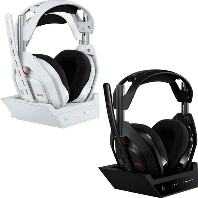 Two gaming headsets with their charging bases, one white and one black, are displayed side-by-side against a white background.