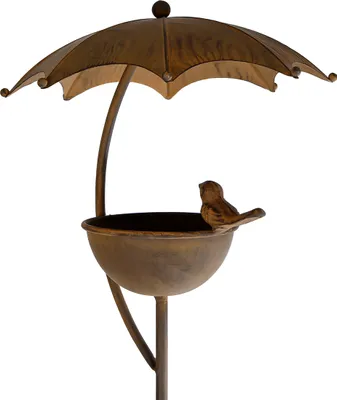 A metal bird feeder shaped like an umbrella with a small bird perched on the edge.