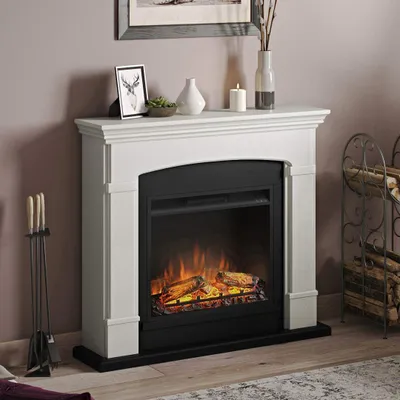 An electric fireplace is shown in a living room setting, with decorative items on the mantelpiece and a log holder nearby.
