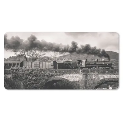 Produktbild von MuchoWow® Schreibtischunterlage Schwarz-Weiß-Fotografie eines Dampfzuges, der eine Brücke überquert 80x40 cm - XXL Mauspad - Gaming Mauspad