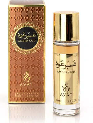 A perfume bottle and its packaging are displayed against a white background.