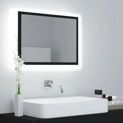 A modern bathroom vanity with a rectangular sink, a sleek faucet, and a large LED-backlit mirror.