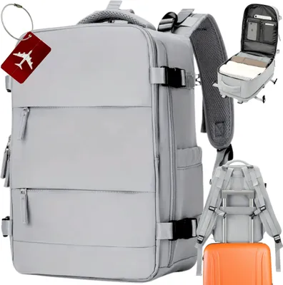 A collection of travel bags and accessories, including a large gray backpack, an orange suitcase, and a red luggage tag with an airplane.