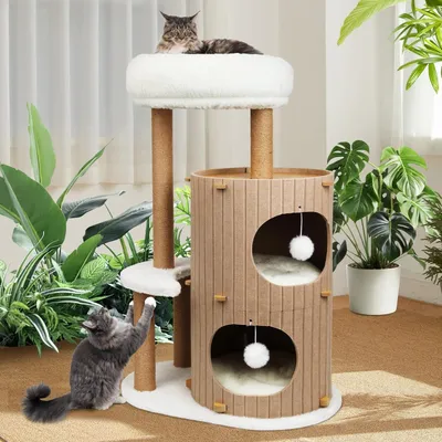 A cat tree with two cats in a room with plants.
