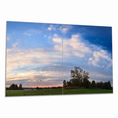 Produktbild von Wallario Herdabdeckplatte aus Glas, Größe 80 x 52 cm 2-teilig, Motiv Morgenhimmel über Wäldern und Wiesen