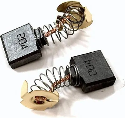 Two carbon brushes with springs and holders, shown against a white background.