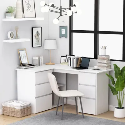 A white corner desk with a chair and office supplies in a room with a large window.