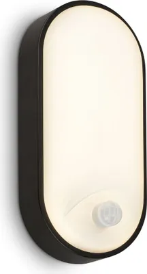 A black and white oval-shaped LED wall light with a motion sensor is mounted on a white wall.