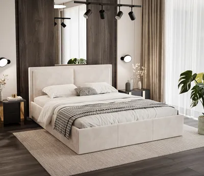 A stylish and modern bedroom setting featuring a large cream-colored upholstered bed as the focal point. The bed is neatly made with crisp white linens, a patterned throw blanket, and decorative pillows. It is placed on a textured rug in a room with dark w
