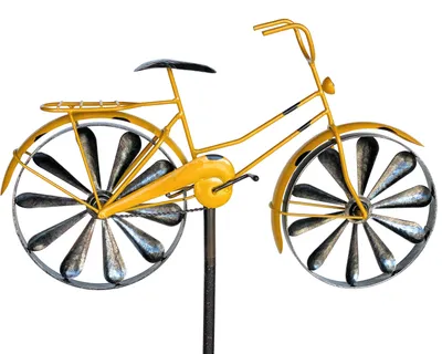 A yellow metal bicycle garden stake with spinning wheels.