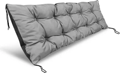 A gray tufted cushion for a bench or pallet.
