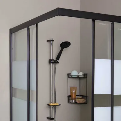 A modern shower cabin with black profiles and frosted glass.