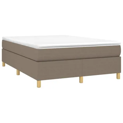 A mattress base with legs, viewed from a side angle.