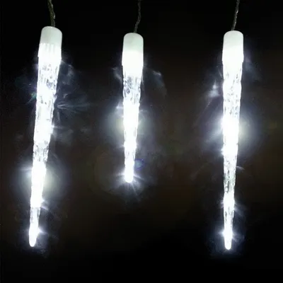 Three illuminated icicle-shaped lights hang against a black background.