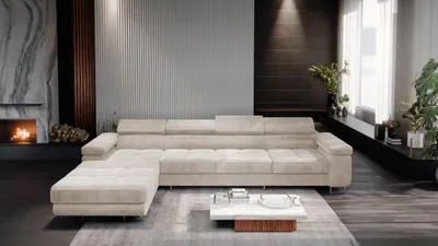 A modern living room with a large sectional sofa, fireplace, and coffee table.