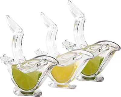 Three clear, bird-shaped lemon squeezers, each holding a slice of citrus fruit, are arranged diagonally against a white background.