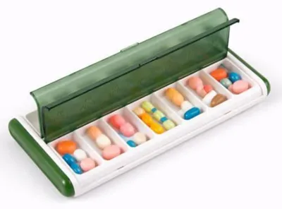 Image de Boîte à comprimés pour 7 jours, avec 2 compartiments. Pour le matin et le soir. Couleur verte. Étanche. Facile à transporter