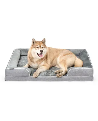 A dog is lying on a dog bed.