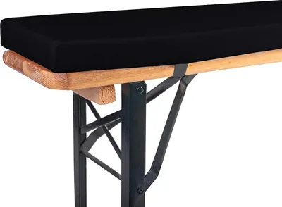 A close-up shot of a black bench cushion on a wooden and metal bench.