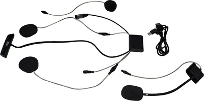 A collection of motorcycle helmet communication system components laid out on a white background.