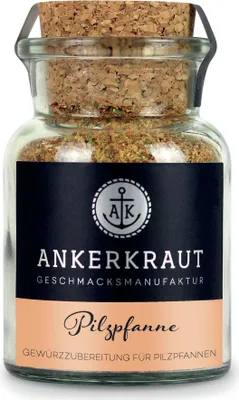 A glass jar of seasoning with a cork lid.