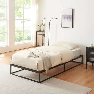 A bedroom scene with a bed, desk, and window.