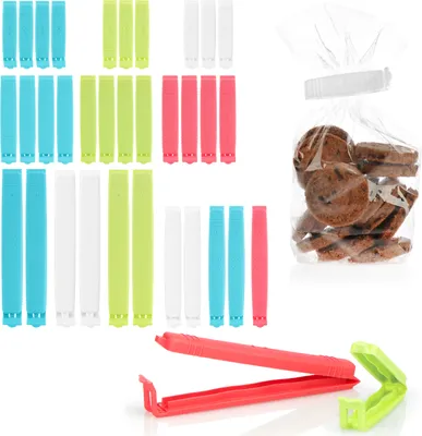 A collection of plastic bag clips in various colors and sizes, along with a bag of cookies sealed with a clip.